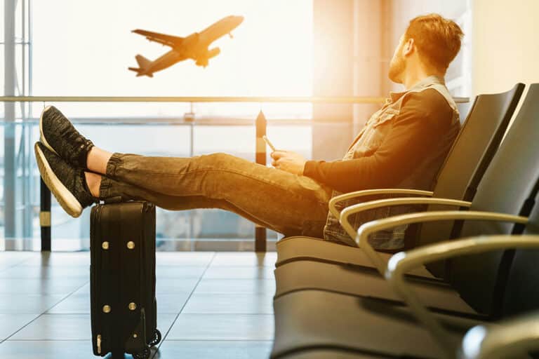 Traveler sitting in the airport contemplating what to do when you’re injured abroad